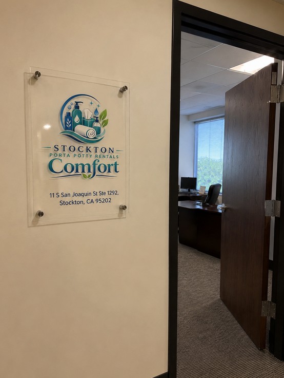Stockton Porta Potty Rentals Comfort suite signage at the office entrance, 11 S San Joaquin St Ste 1292