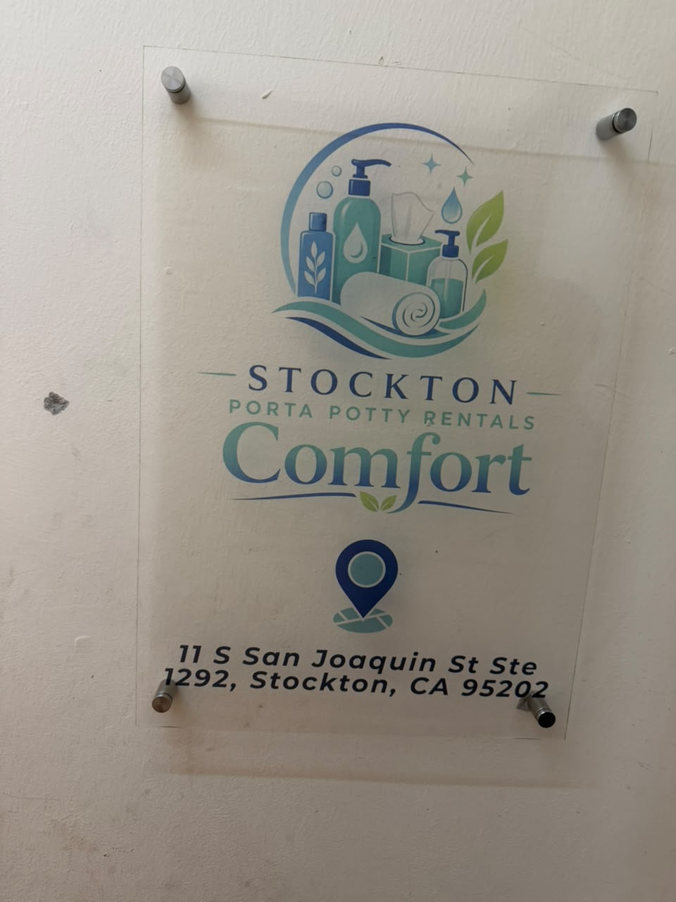 Acrylic entrance sign reading Stockton Porta Potty Rentals Comfort, 11 S San Joaquin St Ste 1292, Stockton, CA 95202